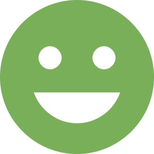 A green smiley face icon on a white background depicting cosmetic dentistry.